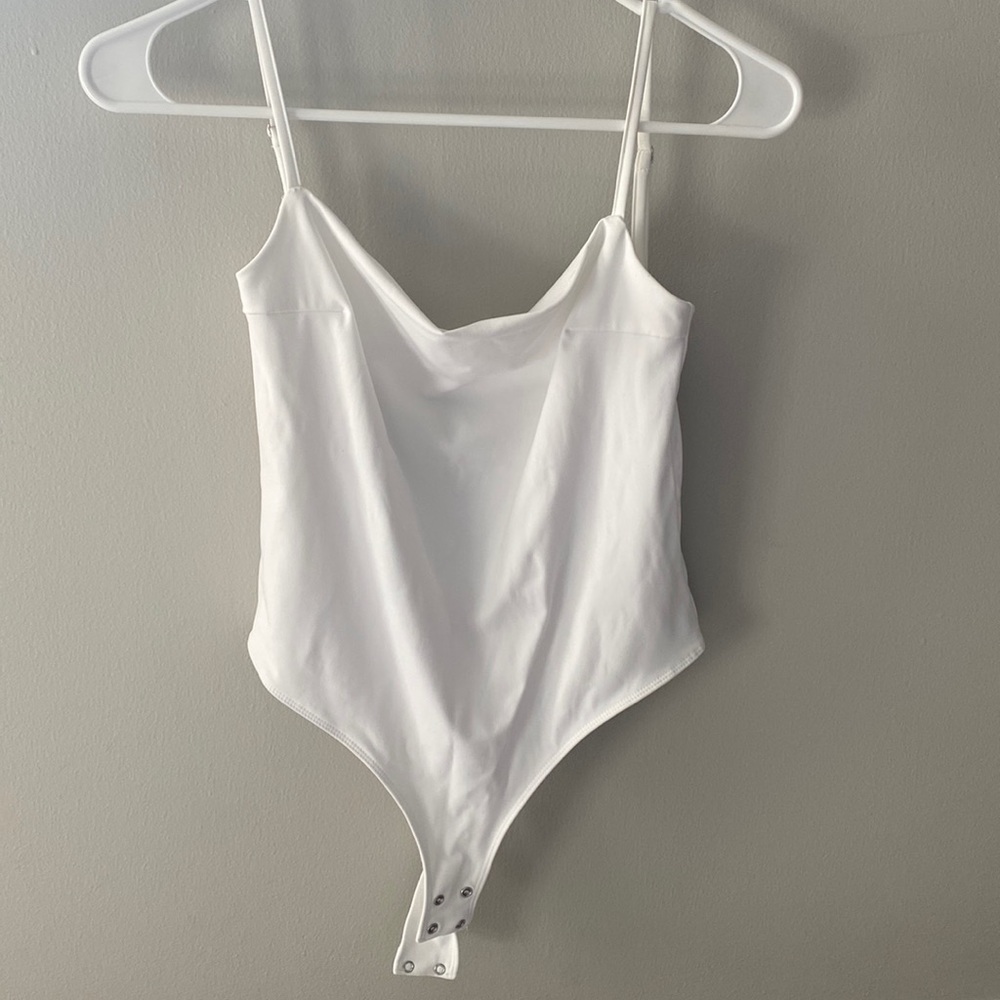 Open back white body suite
